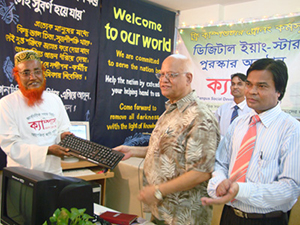 Finance Minister AMA Muhith handed over Computers to the Awardee of Digital Young Star Award as Chief Guest; Dr. M Helal is presiding over. (2010)